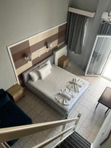 Postel nebo postele na pokoji v ubytování Ellas Hotel