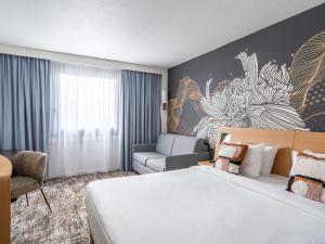 Postel nebo postele na pokoji v ubytování Novotel Paris Charenton le Pont