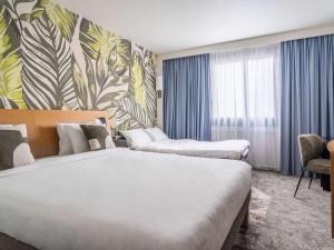 Postel nebo postele na pokoji v ubytování Novotel Paris Charenton le Pont