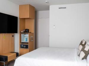 Postel nebo postele na pokoji v ubytování Novotel Paris Charenton le Pont