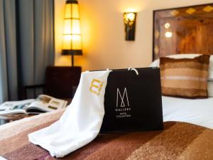 Ліжко або ліжка в номері Le Médina Essaouira Thalassa Sea & Spa - MGallery Collection