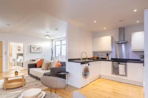 a kitchen and living room with a couch and a table at 1 Bed Apartment - Redhill Central, Surrey, Gatwick #4 in Redhill
