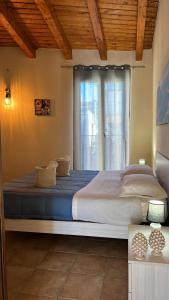 Postel nebo postele na pokoji v ubytování Domus Mea Apartments