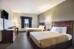 Postel nebo postele na pokoji v ubytování Econo Lodge