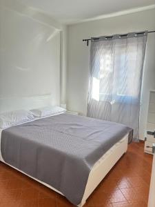 Ένα ή περισσότερα κρεβάτια σε δωμάτιο στο La casetta di Dany