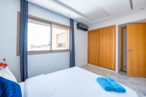 Una cama o camas en una habitación de Appartement au centre de gueliz