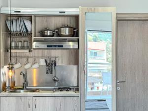 a kitchen with a sink and some pots and pans at Haus Petris in Sarti