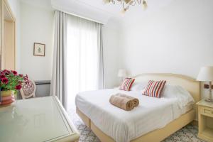 Łóżko lub łóżka w pokoju w obiekcie La Reginella Resort & Spa
