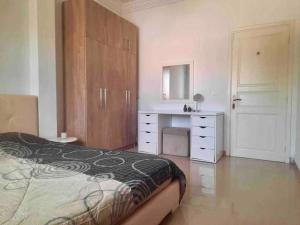 Postel nebo postele na pokoji v ubytování Appartement haut standing à Menzeh5