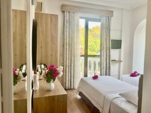 Postel nebo postele na pokoji v ubytování Carikci Hotel + 36 fotografií