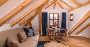 a living room with a couch and a table at Oleander Trogir Suites in Trogir