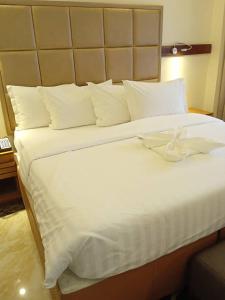 Letto o letti in una camera di Mulligan Hotel