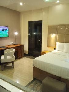 Letto o letti in una camera di Mulligan Hotel