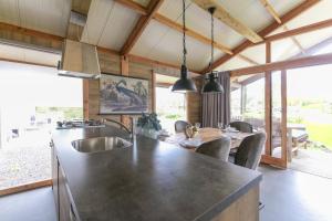 a kitchen with a large island in a house at Camping Heino in Heino