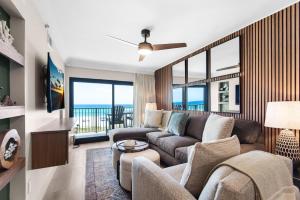a living room with a couch and a table at Sundunes 122 in Navarre