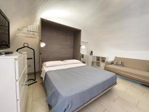 Postel nebo postele na pokoji v ubytování Apartment Maison Favola - Affitti Brevi Italia + 6 fotografií
