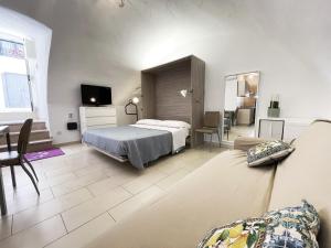 Postel nebo postele na pokoji v ubytování Apartment Maison Favola - Affitti Brevi Italia