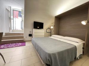 Postel nebo postele na pokoji v ubytování Apartment Maison Favola - Affitti Brevi Italia