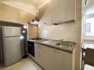 Kuchyň nebo kuchyňský kout v ubytování Apartment Maison Favola - Affitti Brevi Italia