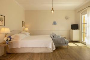 Cama ou camas em um quarto em Dorion Hotel