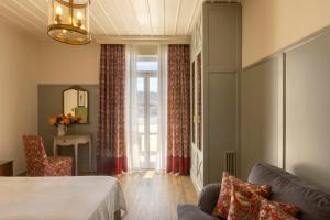 Cama ou camas em um quarto em Dorion Hotel
