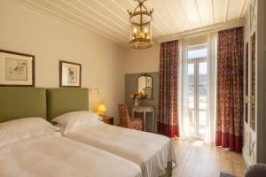Cama ou camas em um quarto em Dorion Hotel