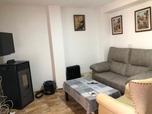 a living room with a couch and a table at La Gloria in Guadix