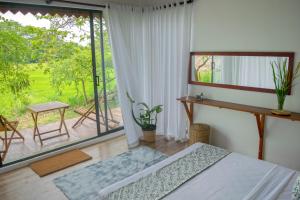 Letto o letti in una camera di Paarvie Sigiriya