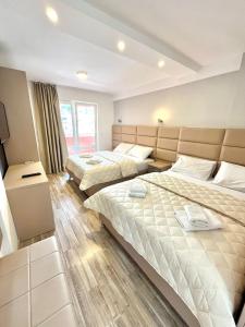 a hotel room with two beds in a room at Apartments Sofija in Budva