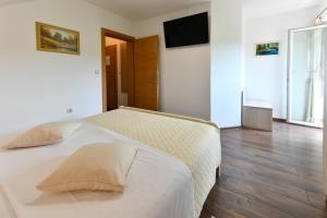 Postel nebo postele na pokoji v ubytování House Marija B&B