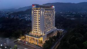 a tall building with lights on top of it at Navi Mumbai Marriott in Navi Mumbai