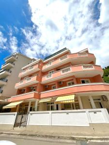 a large apartment building with a sky in the background at Apartments Sofija in Budva