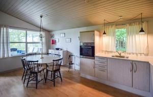 Kuchyň nebo kuchyňský kout v ubytování Holiday Home R Sommerland X