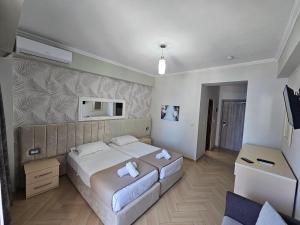 Postel nebo postele na pokoji v ubytování Hotel Pini