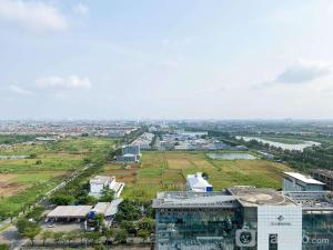 an aerial view of a city with a building at Compact and Comfortable Studio Sayana Bekasi Apartment By Travelio in Bekasi
