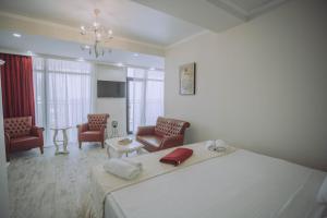 Postel nebo postele na pokoji v ubytování Royal Medis Hotel