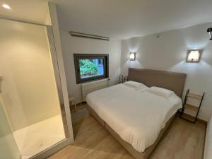 Letto o letti in una camera di Gite Fond des Vaulx