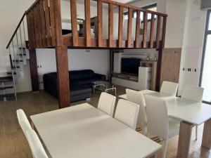 a living room with white tables and white chairs at B&B Stella Irpina in Teora
