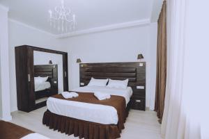 Postel nebo postele na pokoji v ubytování Royal Medis Hotel