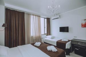 Postel nebo postele na pokoji v ubytování Royal Medis Hotel