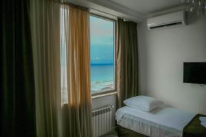 Postel nebo postele na pokoji v ubytování Royal Medis Hotel