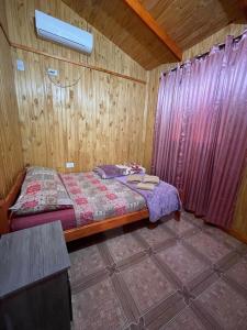 Postel nebo postele na pokoji v ubytování Cabañas Josesito + 8 fotografií