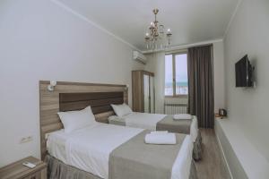 Postel nebo postele na pokoji v ubytování Royal Medis Hotel