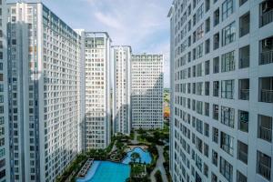 an aerial view of a city with tall buildings at Best Deal 3BR Apartment M-Town Residence near Summarecon Mall By Travelio in Tangerang