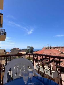 a table and chairs on a balcony with a view at Porta sul Mare in Tropea
