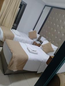 Ένα ή περισσότερα κρεβάτια σε δωμάτιο στο Shami Plaza Hotel