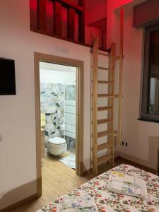 a bedroom with a bunk bed and a ladder at B&B Stella Irpina in Teora +6 photos