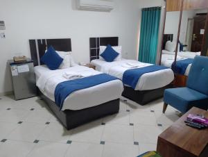 Ένα ή περισσότερα κρεβάτια σε δωμάτιο στο Shami Plaza Hotel