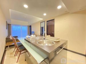 a bathroom with a sink and a mirror at Fancy and Nice 2BR at Braga City Walk Apartment By Travelio in Bandung +21 photos