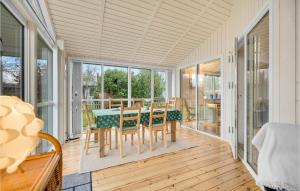 a dining room with a table and chairs at Nice Home In Beder With Kitchen in Beder